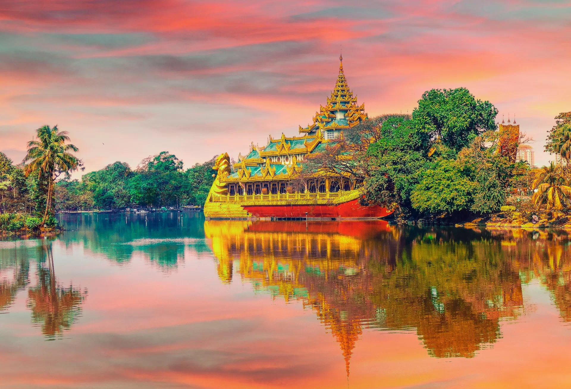 Pic of a Thai temple reflecting on the water at sunset.