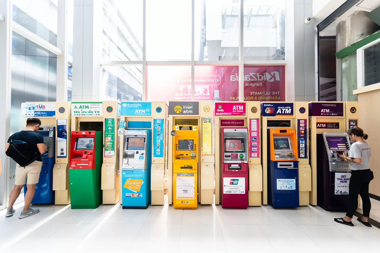 Image of a row of Thai ATMs from each Thai bank.