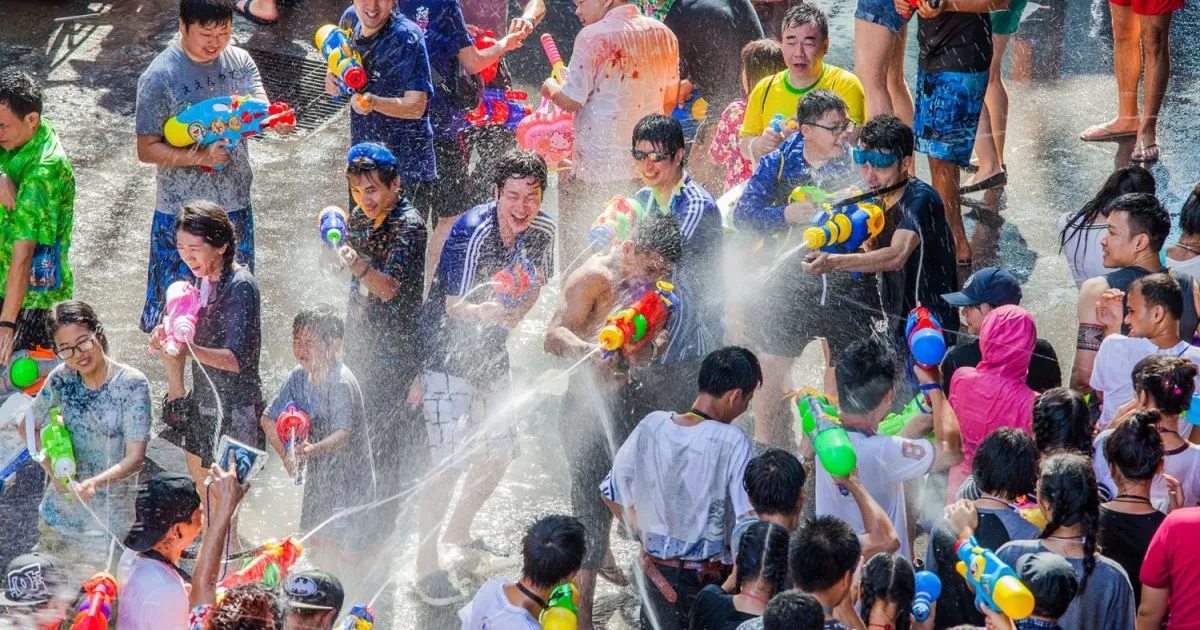 Pic of revelers celebrating Songkran Festival in Thailand with waterguns.